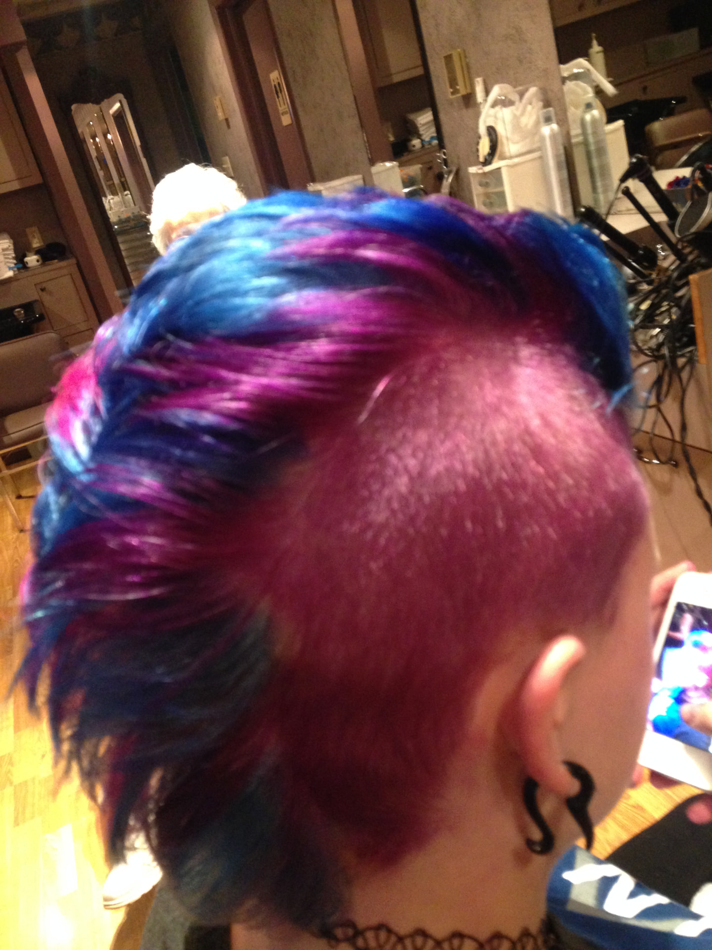Vivid blue and magenta creative color with shaved side